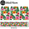 Three pieces of floral print table mats measuring 35x275cm for a Hawaiian luau party set