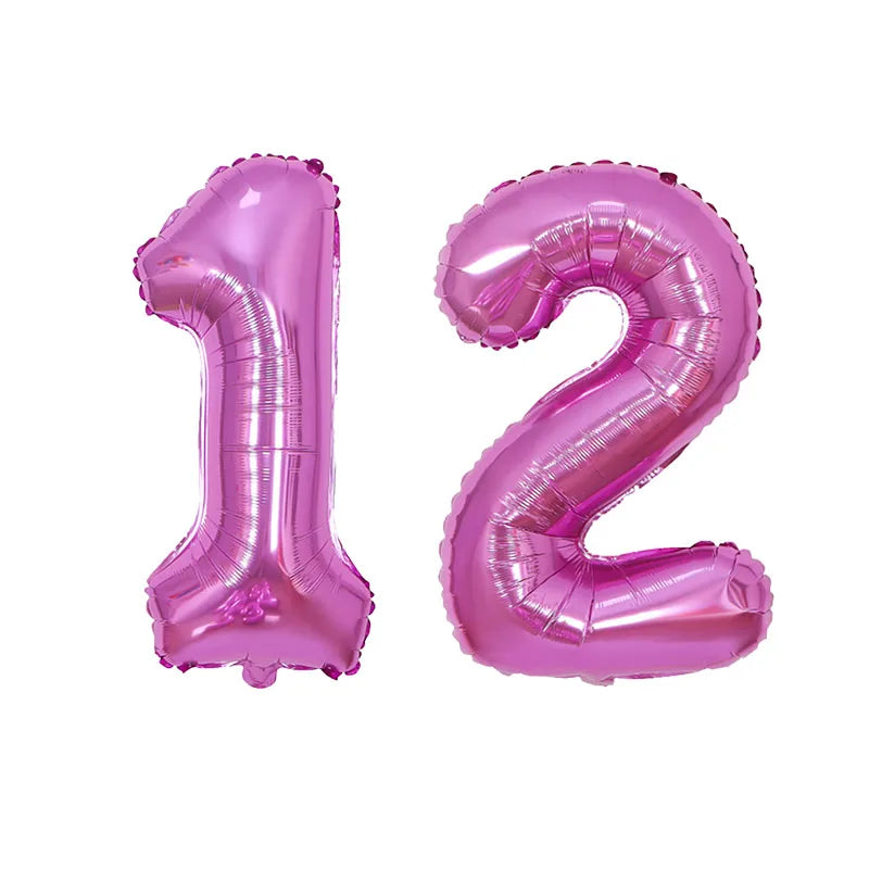 Two foil balloons shaped like the numbers 1 and 2 in pink for birthday party decor