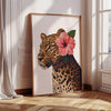 Wall art featuring a painting of a leopard's head with a pink hibiscus flower on a neutral background.