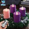 A set of purple and pink flameless LED candles with a remote control resting on a green pine branch.