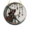 Stained glass window decor featuring a witch figure in a pointed hat and ornate jewelry