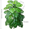 A vibrant green artificial Monstera plant with large silk leaves shown in a vertical orientation.