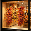 An autumn sunflower teardrop swag with maple leaves hanging in a display window.