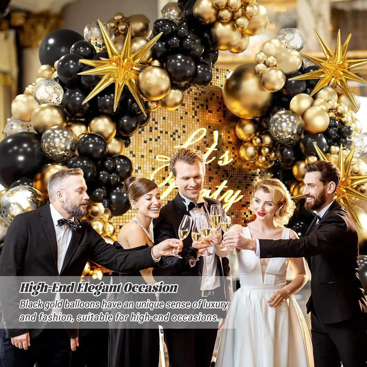 A group of people posing in front of an elegant black and gold balloon garland arch decorated with starburst accents.
