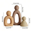 A set of three modern resin family statues in a neutral beige color.