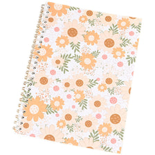 A spiral-bound reusable sticker collecting album with a floral pattern featuring orange and pink daisies.
