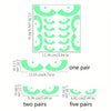 A grid pattern of glow-in-the-dark Halloween eye window cling decals shown in various pair quantities.