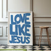 Framed wall art print featuring the text Love Like Jesus in bold blue lettering on a white background