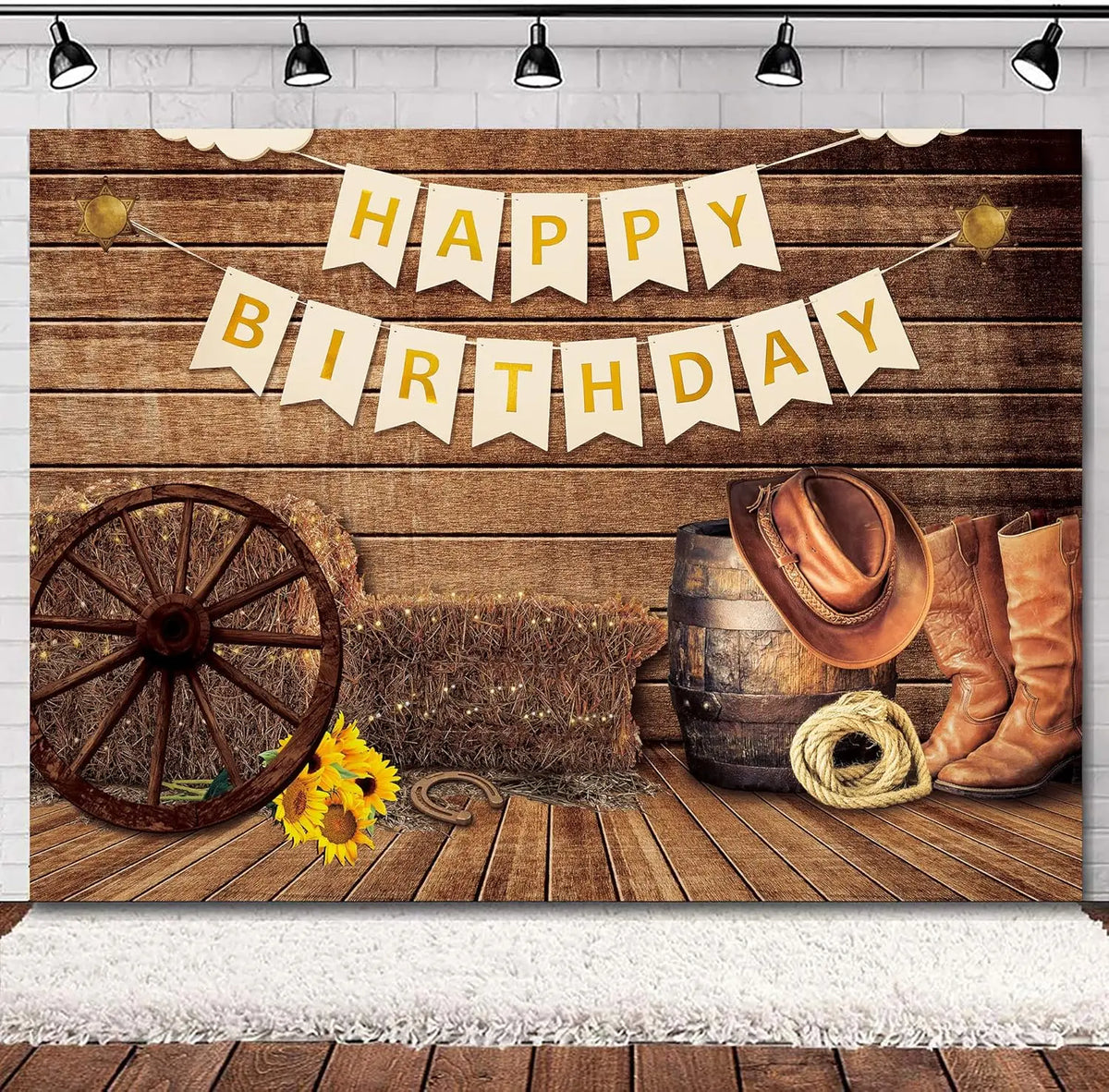 A rustic western backdrop featuring a wooden barn door, hay, and a banner that reads Happy Birthday.