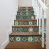 A staircase with decorative tile accents featuring green and beige patterns on the risers and treads.