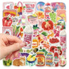 A hand is touching a sheet of retro cute food pattern decals featuring various fruits and vegetables.