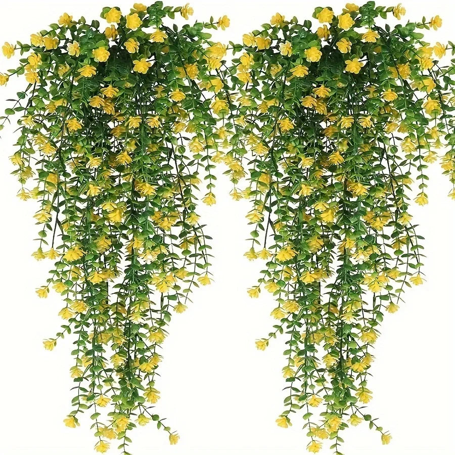 A set of three lifelike faux eucalyptus hanging plants with yellow flowers.