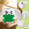 A white crochet toilet roll shaped potato doll with an inspirational message and a small card.