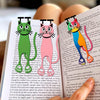A set of decorative acrylic cat bookmarks featuring various cats in green, pink, and orange colors.