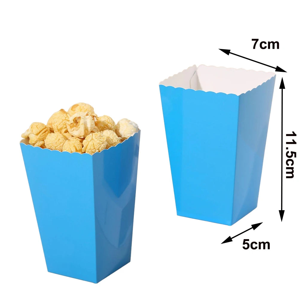 A blue disposable paper cup filled with yellow popcorn, shown next to a dimensioned view.