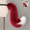 A long, flowing faux fur tail and ear costume in deep red and white is displayed against a light background.