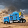 A blue armored truck model with a large yellow chaser arm is shown in a desert landscape.