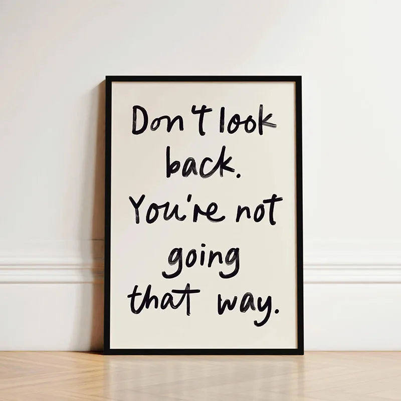 Black framed canvas wall art featuring the quote Don't look back. You're not going that way.