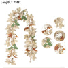 A long artificial maple leaf garland featuring brown and green leaves with white and orange accents.
