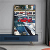 A canvas wall art featuring a painting of a red sports car being lifted by a crane near a waterfront.