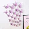 A set of purple and pink 3D hollow butterfly wall decals scattered on a white background.