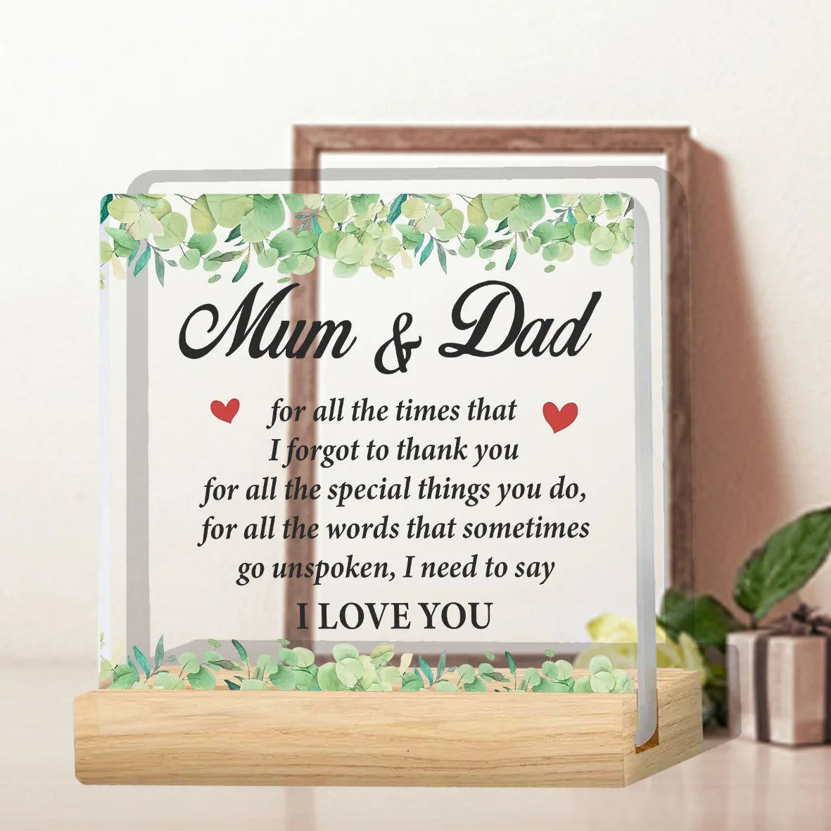 A clear acrylic thank you plaque with a wooden frame and greenery, featuring the text Mum & Dad for all the times that I forg