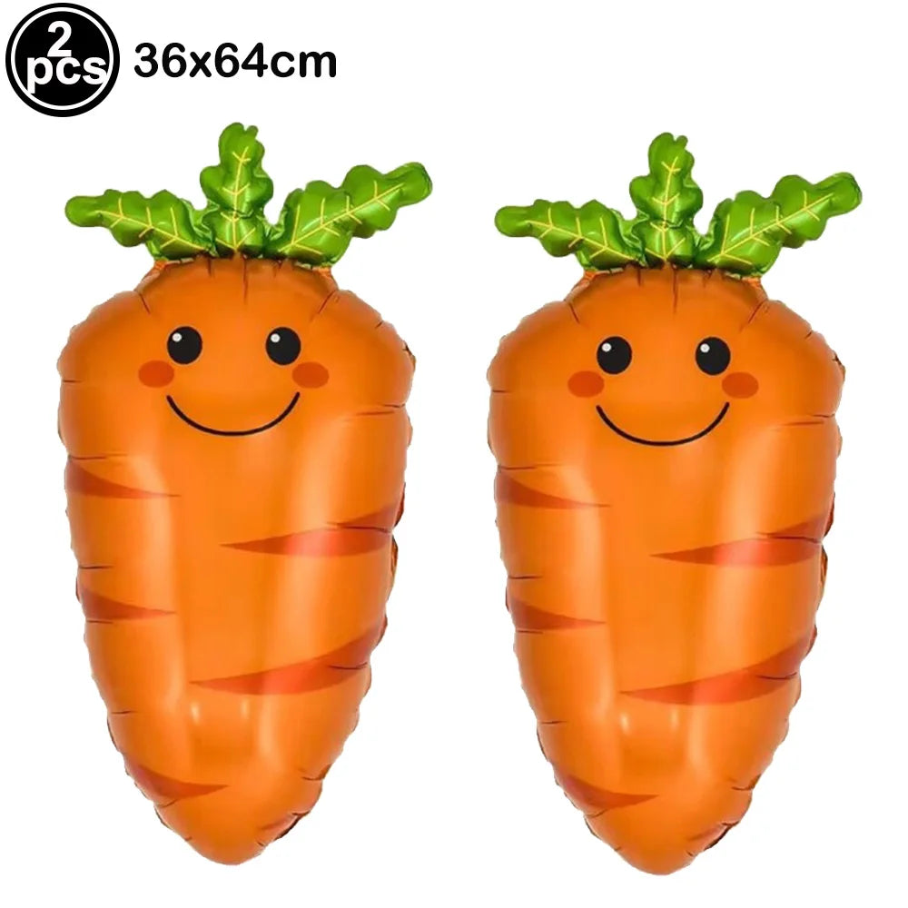 Two orange carrot shaped foil balloons with green leafy tops