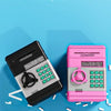 A black automatic mini cash saving piggy bank and a pink version are shown against a blue background with scattered white pla
