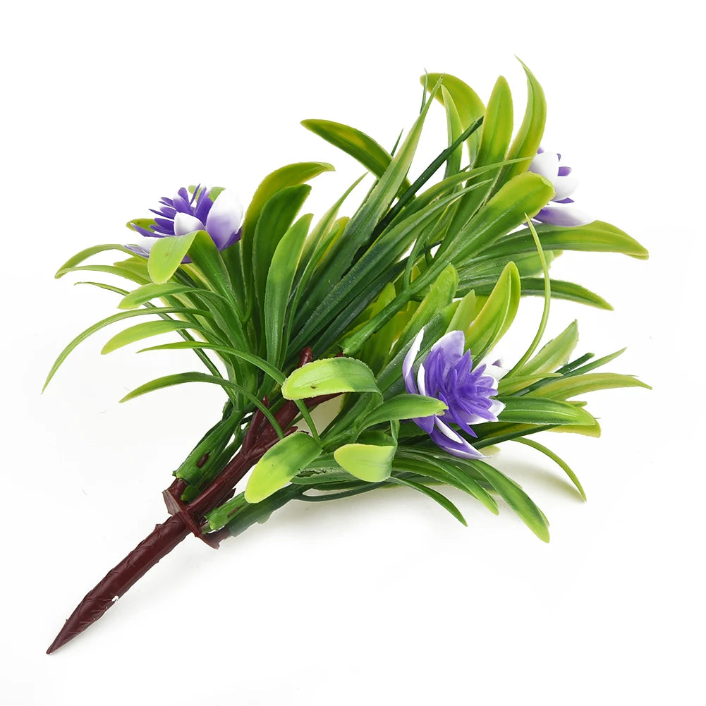 Artificial lotus flower in decorative pot used as faux bonsai desk decor