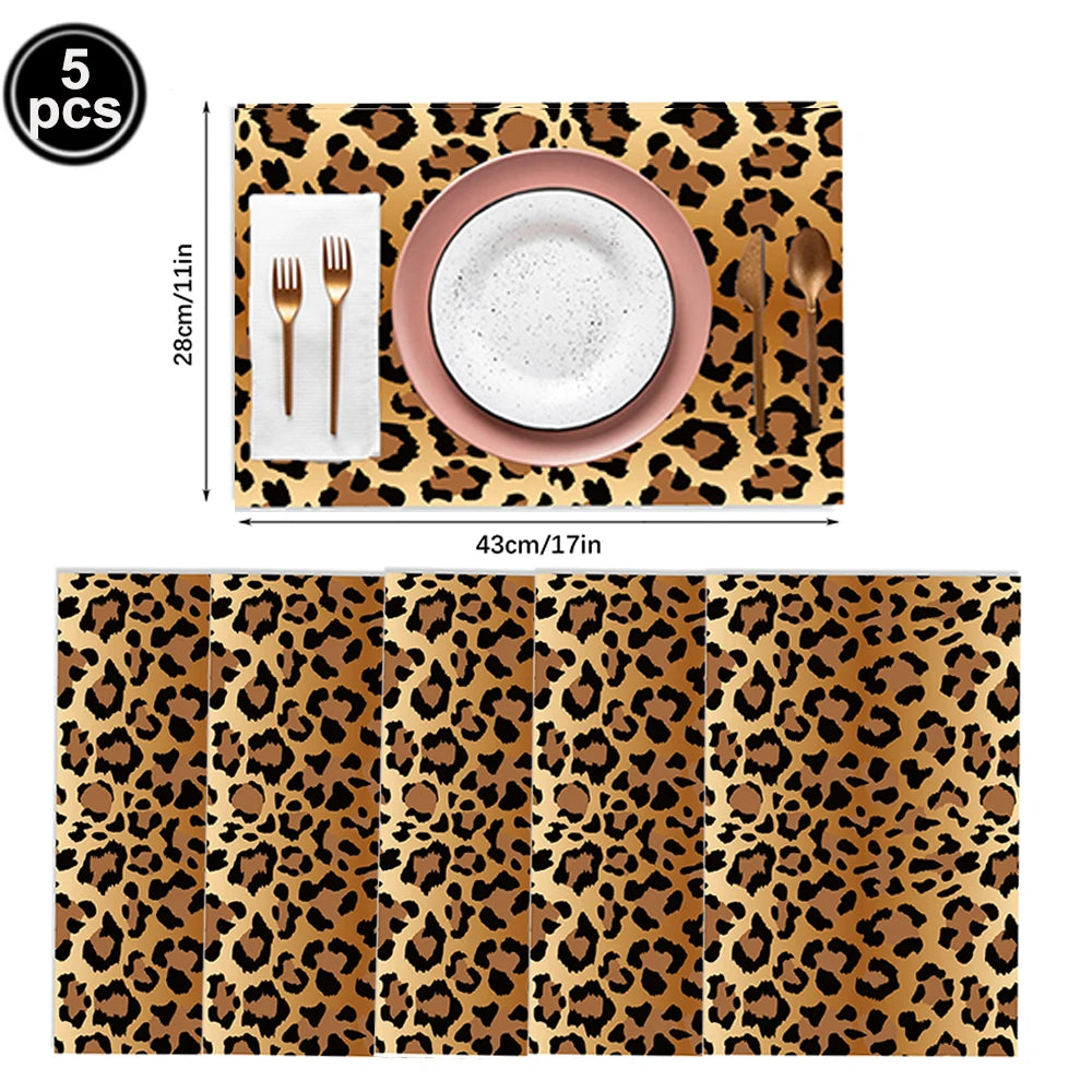 A set of five leopard print foil balloons for party decorations, including a plate and cutlery.