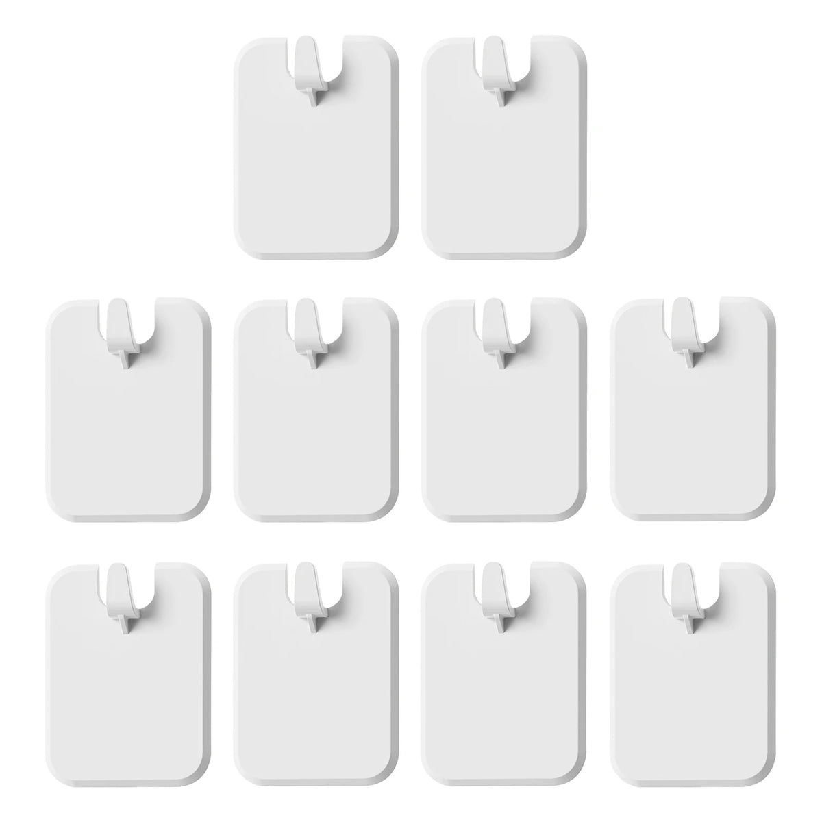 A set of white damage-free self-adhesive picture hangers in various sizes and shapes.
