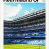 A panoramic view of the Real Madrid CF stadium during a match, showing the pitch and stands under a bright sky.