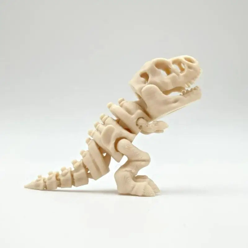 A white 3D printed dinosaur skeleton model displayed against a light background.
