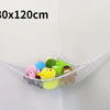 A white mesh storage hammock organizer for stuffed animals is displayed against a white wall.