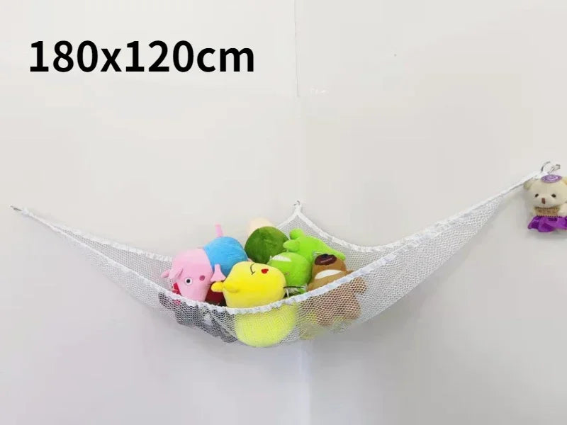 A white mesh storage hammock organizer for stuffed animals is displayed against a white wall.