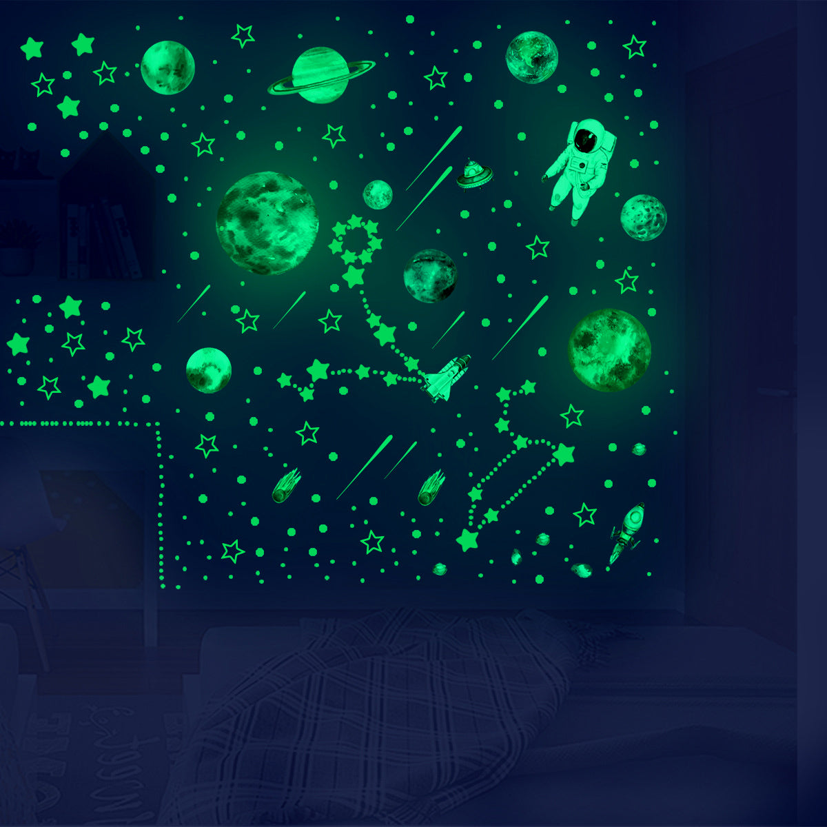 A wall decal featuring glowing green stars and planets in a dark room.