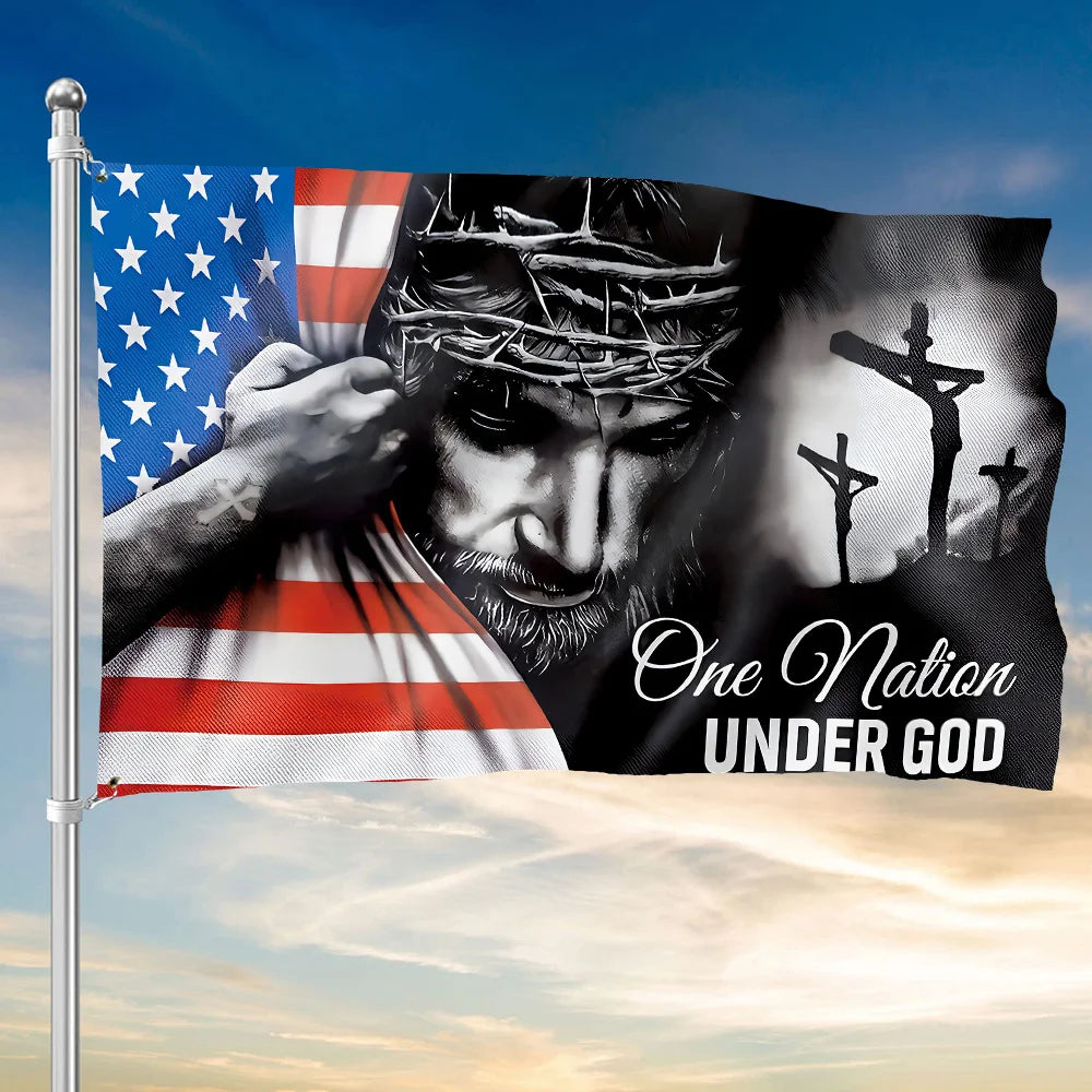 A dark banner flag featuring a Jesus-like face and crosses, with the text One Nation Under God, waving in the wind.