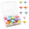 A clear storage box containing various colored decorative pentagram thumb tacks for crafting and display.