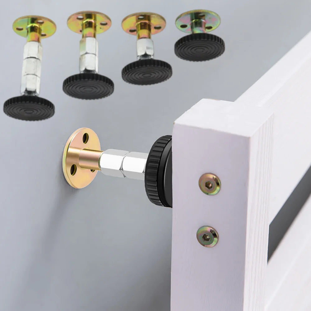 A set of adjustable bed stabilizers with black discs and silver mounts mounted on a white wooden frame.