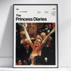 A framed poster titled The Princess Diaries featuring a scene from the movie with a woman raising her arm.