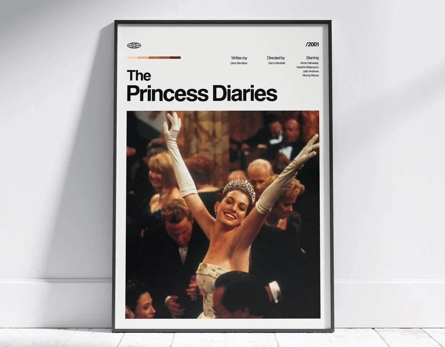 A framed poster titled The Princess Diaries featuring a scene from the movie with a woman raising her arm.