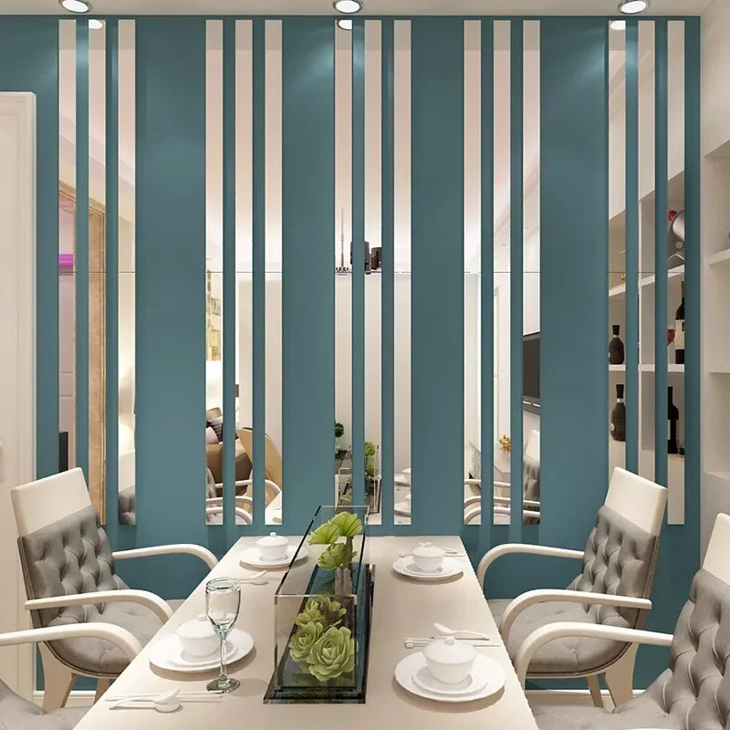 A modern living room featuring a teal wall with vertical acrylic mirror strips and light gray upholstered chairs.