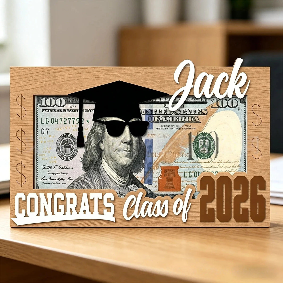 A wooden box featuring a graduation theme with the name Jack and congrats for the Class of 2026