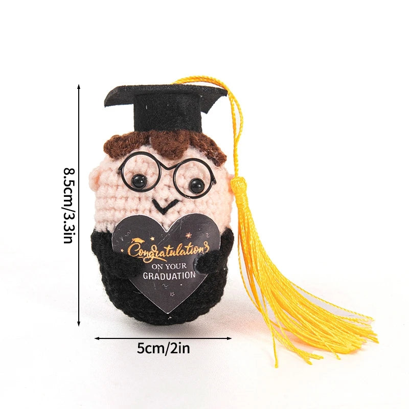 Handmade crochet potato doll wearing a graduation cap with an inspirational slogan on its chest