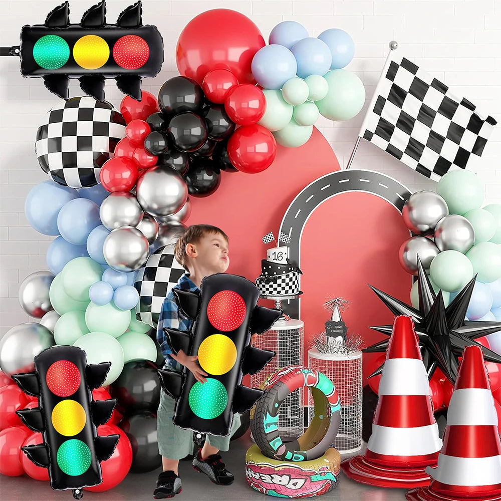 A collection of red, black, and silver balloons shaped like race car traffic lights.