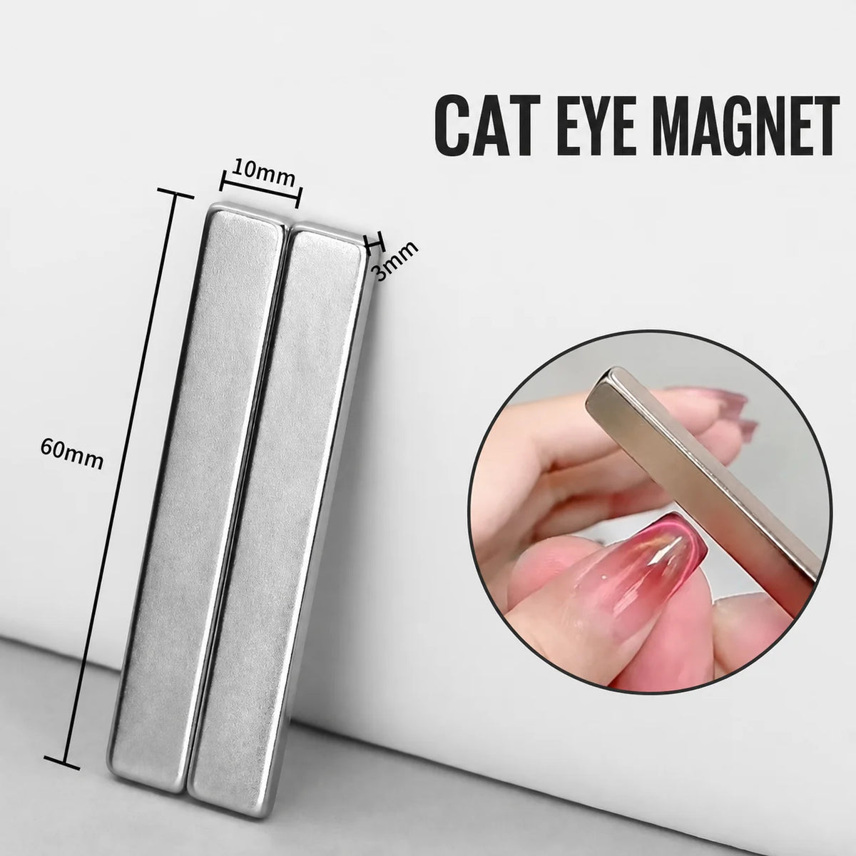 A silver rectangle cat eye magnet shown next to a ruler for scale, demonstrating its size.