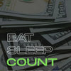 لقطة مقربة لعملات الدولار الأمريكي مع النص 'EAT SLEEP COUNT REPEAT' فوقها.