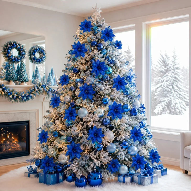 A large artificial Christmas tree decorated with blue glitter poinsettia flowers and silver ornaments in a bright room.