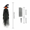 A black witch decoration set featuring a Halloween-themed face and several light-up items.