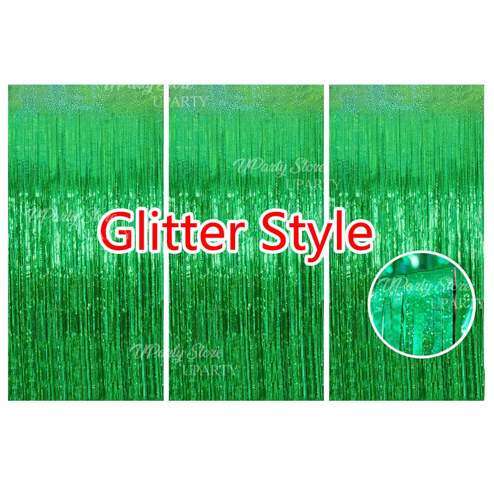 Green glitter style metallic foil fringe curtains used as a party backdrop decor